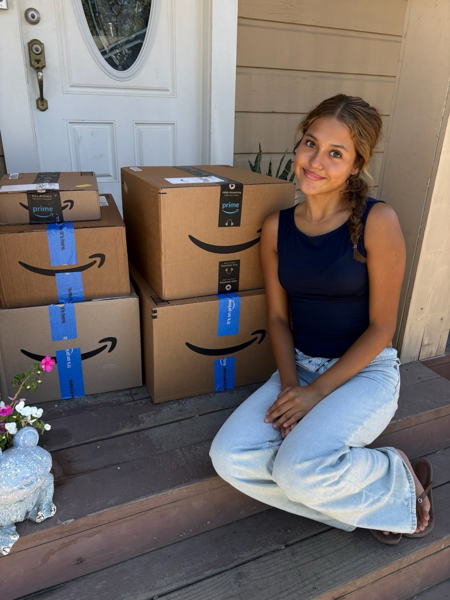 A student at home with her delivered move-in kit