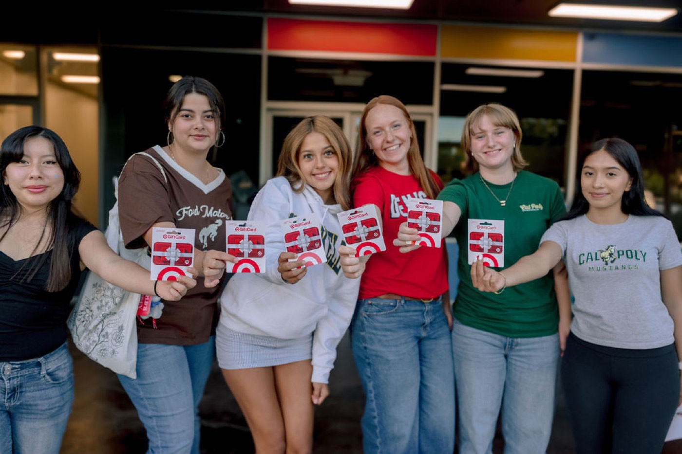 Students holding their Target gift cards at the Orientation and Celebration